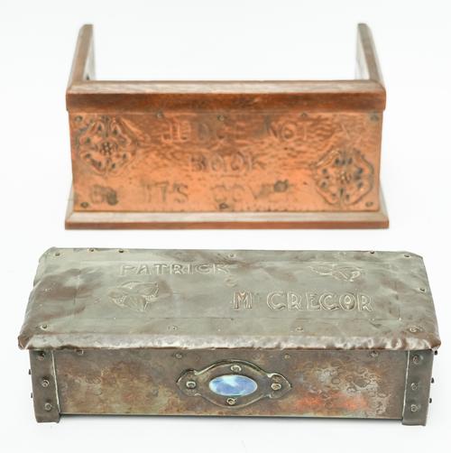 A SPOT HAMMERED COPPER TOBACCO BOX AND AN ARTS & CRAFTS COPPER MOUNTED OAK BOOK TROUGH (2)