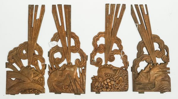 FOUR ART DECO GILT CAST-IRON ARCHITECTURAL MOUNTS DEPICTING THE FOUR PERSONIFICATIONS OF THE WINDS OR GREEK ANEMOI (4)