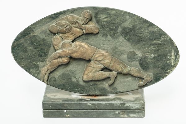 A MARBLE AND BRONZE GROUP OF RUGBY PLAYERS