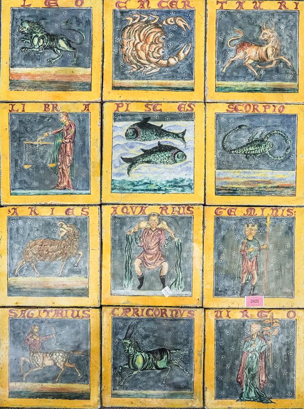 A SET OF TWELVE POTTERY `ZODIAC' TILES (12)