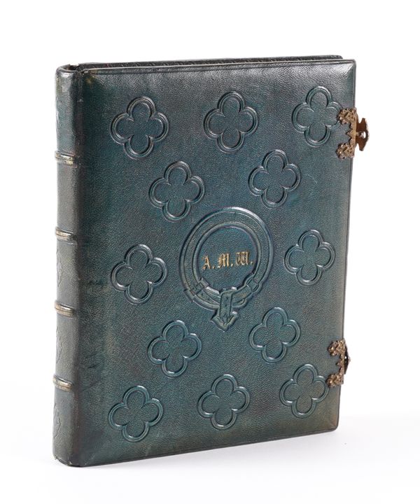 ALBUM - An album on c.18 card leaves containing numerous mounted embossed crests, many heightened in gold, with very fine painted mount designs, mostly floral but including croquet motifs, Oxford and Cambridge college crests, etc, 4to, 19th-century.
