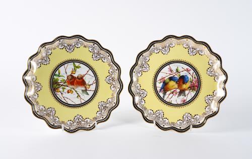 A PAIR OF COALPORT YELLOW-GROUND PLATES (2)