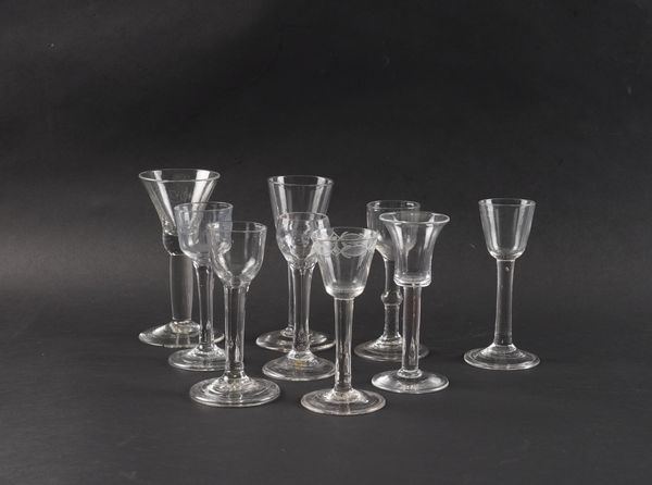 A GROUP OF NINE PLAIN STEMMED WINE GLASSES (9)