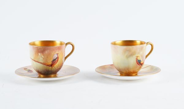 A PAIR OF ROYAL WORCESTER COFFEE CUPS AND SAUCERS (4)