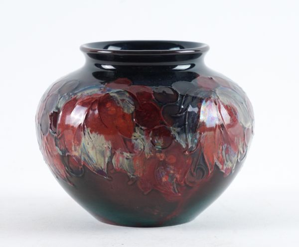 A SMALL MOORCROFT FLAMBE SQUAT VASE