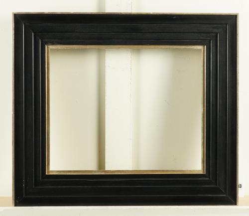 A BLACK PAINTED STEPPED FRAME WITH SILVER PAINTED OUTER BOARDER AND SLIP