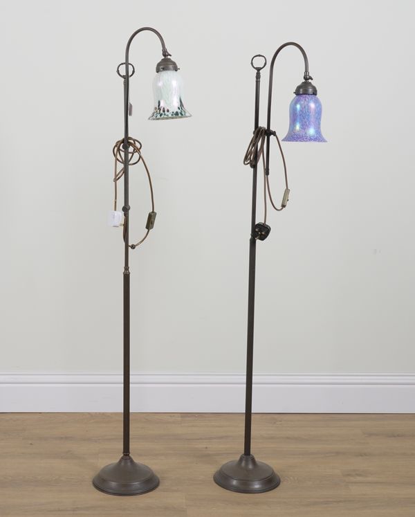 TWO SIMILAR PATINATED METAL AJUSTABLE FLOOR STANDING LIGHTS (2)