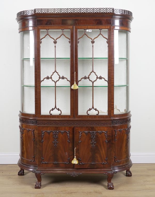 C. BAKER; AN 18TH CENTURY STYLE CARVED MAHOGANY BOWFRONT DISPLAY CABINET CUPBOARD