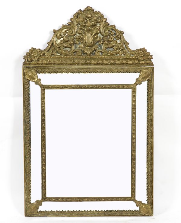 A 19TH CENTURY DUTCH BRASS CUSHION FRAMED WALL MIRROR