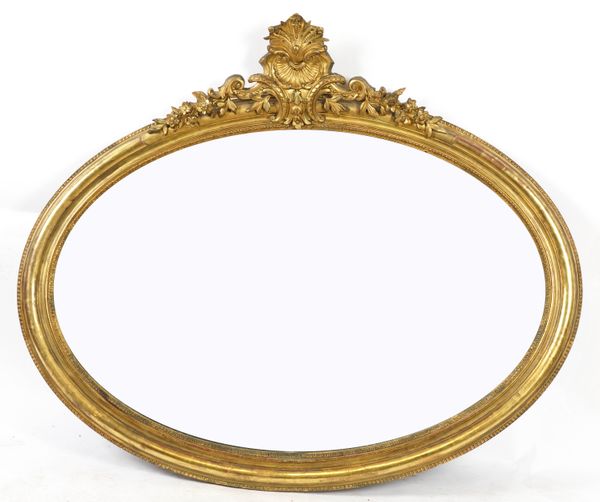 A LARGE VICTORIAN GILT FRAMED OVAL MIRROR