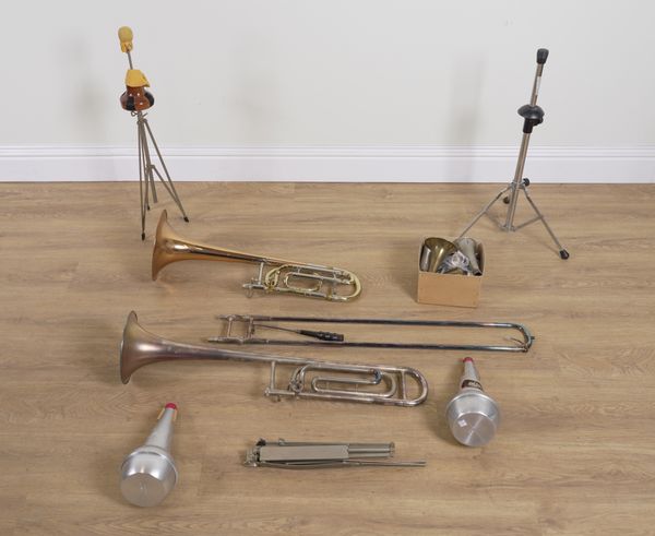 TWO CASED TROMBONES AND A COLLECTION OF ACCESSORIES INCLUDING MOUTHPIECES AND MUTES (QTY)