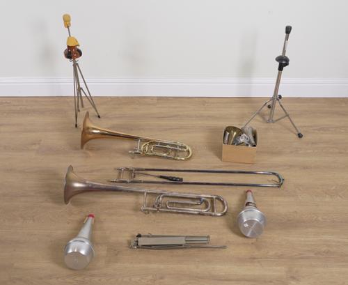 TWO CASED TROMBONES AND A COLLECTION OF ACCESSORIES INCLUDING MOUTHPIECES AND MUTES (QTY)