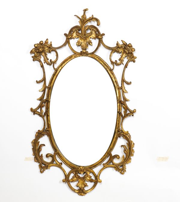 A GEORGE III STYLE GILT FRAMED OVAL WALL MIRROR