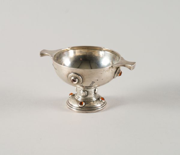 A SILVER AND ORANGE PASTE SET TWIN HANDLED PEDESTAL BOWL