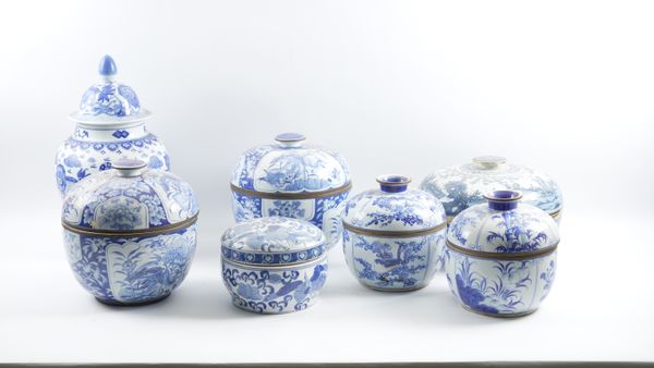 A GROUP OF SEVEN CHINESE BLUE AND WHITE COVERED TUREENS AND A COVERED BALUSTER JAR  (7)