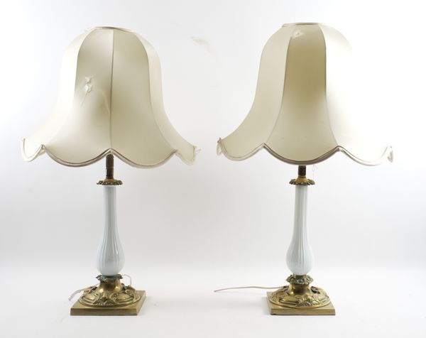 A PAIR OF LATE VICTORIAN WHITE OPALINE GLASS AND BRASS MOUNTED TABLE LAMPS (3)