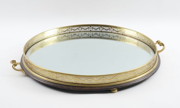 A GILT-METAL AND MIRRORED GLASS CIRCULAR TRAY