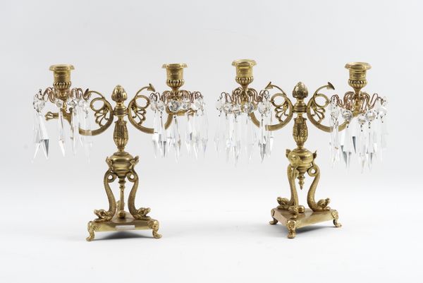 A PAIR OF REGENCY GILT-BRASS TWIN LIGHT CANDELABRA (2)