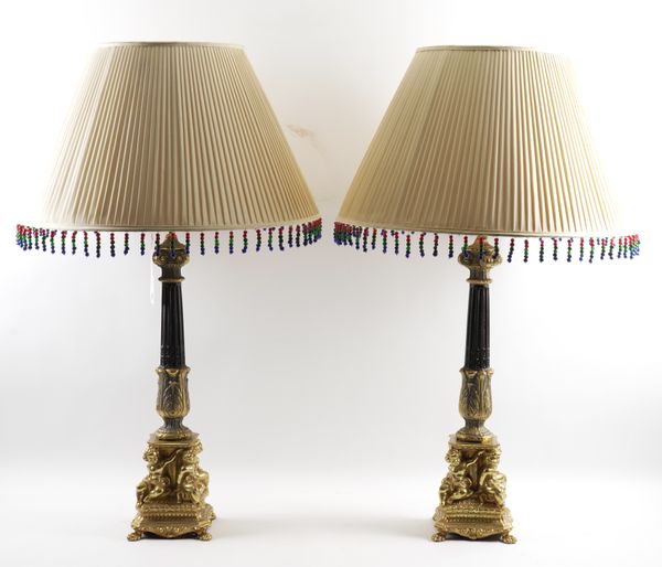 A PAIR OF BLACK AND GILT METAL CORINTHIAN COLUMN TABLE LAMPS (2)