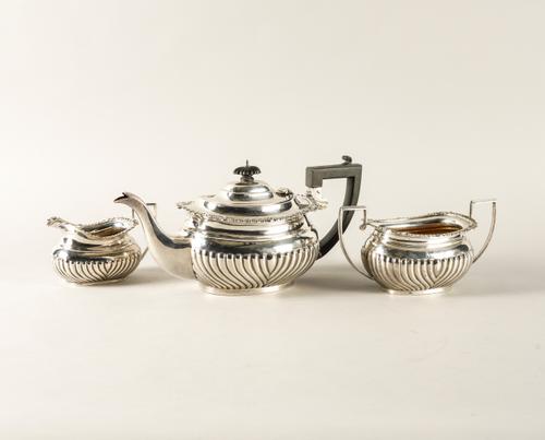A SILVER THREE PIECE TEA SET