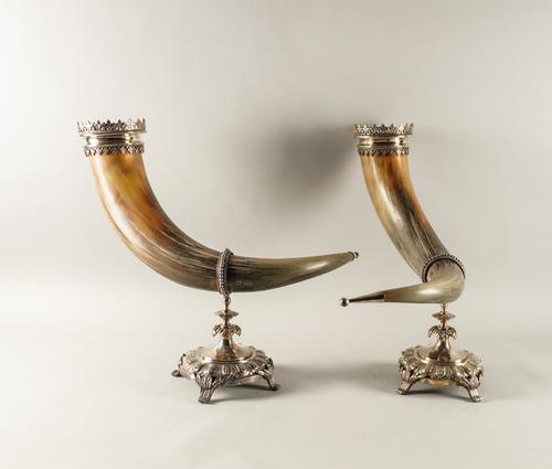 A PAIR OF VICTORIAN SILVER PLATED METAL MOUNTED COW HORN STANDS