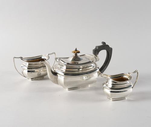 A SILVER THREE PIECE TEA SET