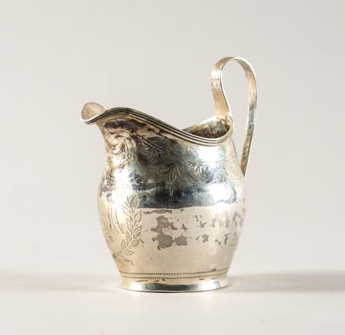 A GEORGE III SILVER MILK JUG