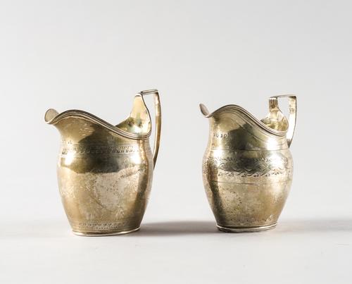 TWO GEORGE III SILVER MILK JUGS (2)