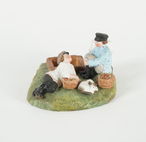 A RUSSIAN BISCUIT PORCELAIN FIGURE GROUP