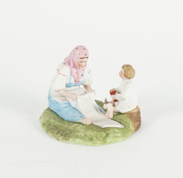 A RUSSIAN BISCUIT PORCELAIN FIGURE GROUP OF MOTHER AND CHILD