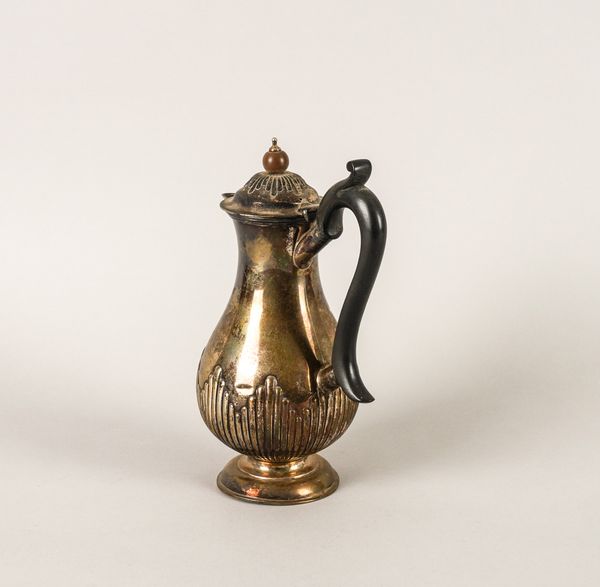 A LATE VICTORIAN SILVER HOT WATER JUG