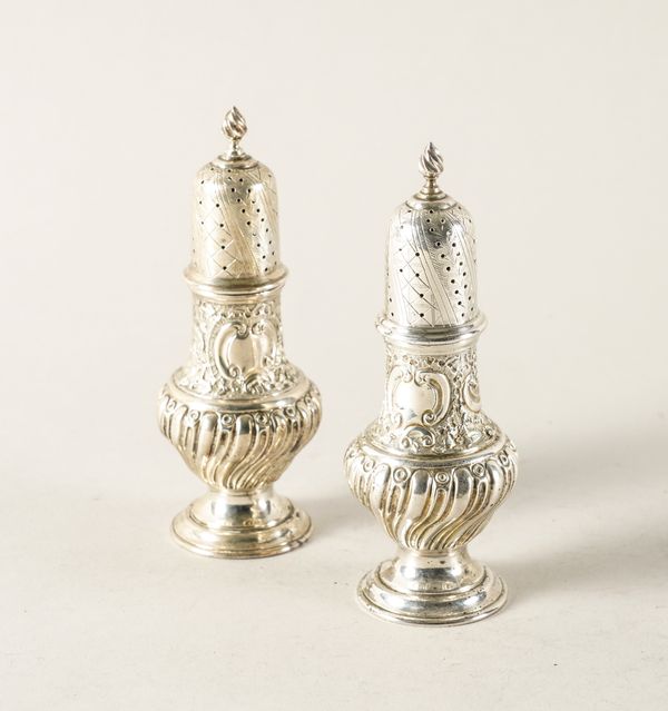 A PAIR OF VICTORIAN SILVER LARGE PEPPER CASTERS