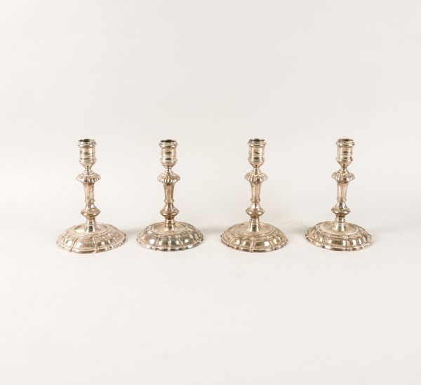 A SET OF FOUR GEORGE II SILVER CAST TABLE CANDLESTICKS (4)