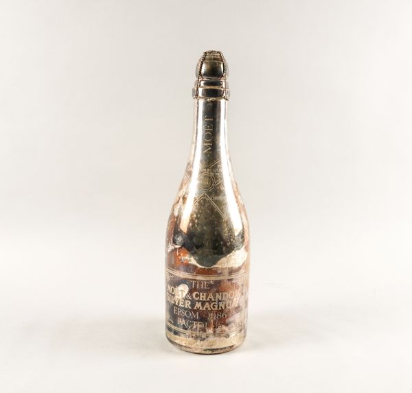 A SILVER MODEL OF A MAGNUM OF CHAMPAGNE