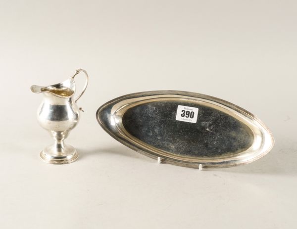 A GEORGE III SILVER OVAL SNUFFER'S TRAY AND A SILVER CREAM JUG (2)