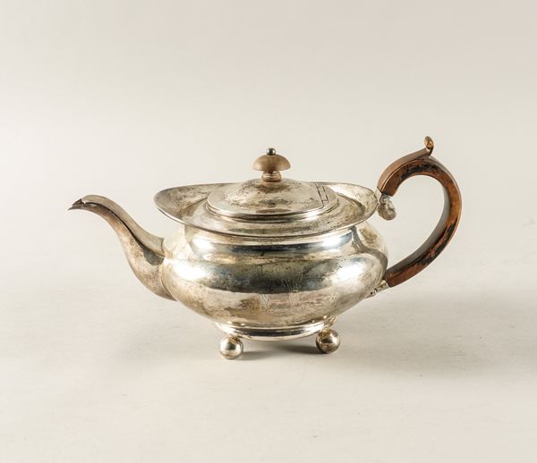 A SILVER TEAPOT