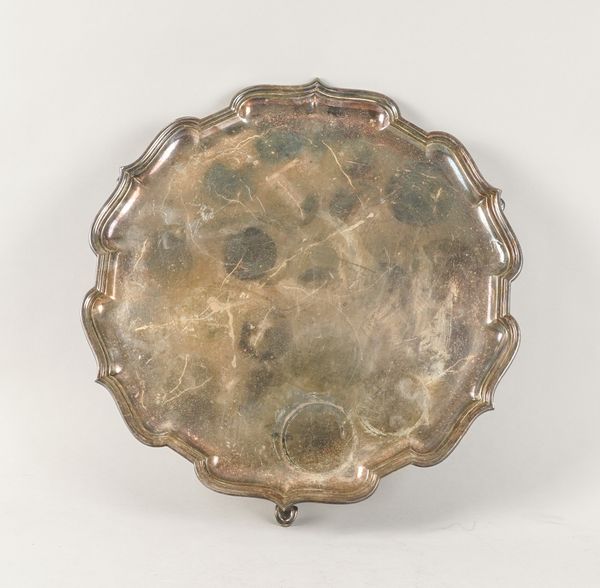 A SILVER LARGE SHAPED CIRCULAR SALVER