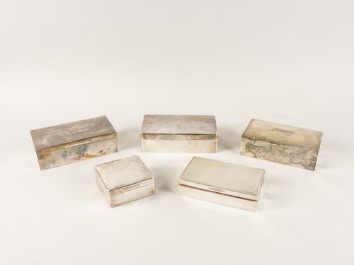 A GROUP OF FIVE SILVER TABLE CIGARETTE BOXES