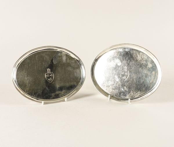 A PAIR OF GEORGE III SILVER OVAL CARD TRAYS (2)