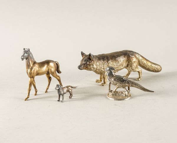 A GROUP OF SILVER MODELS OF ANIMALS (4)