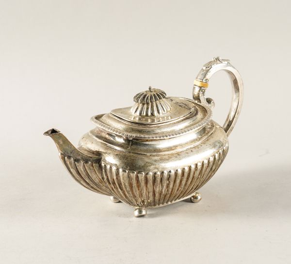 A SILVER TEAPOT