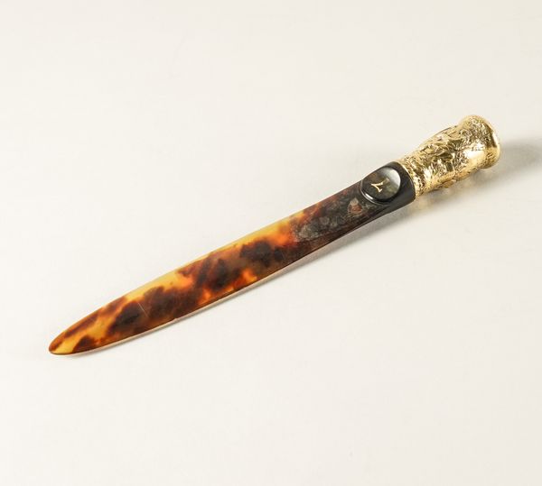 A GOLD HANDLED TORTOISESHELL BLADED PAPER KNIFE