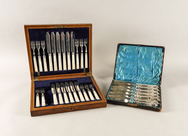 A PART SET OF SILVER AND NOTHER-OF-PEARL FISH KNIVES AND FORKS