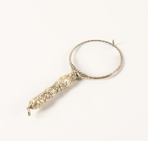 A SILVER GILT MOUNTED MAGNIFYING GLASS