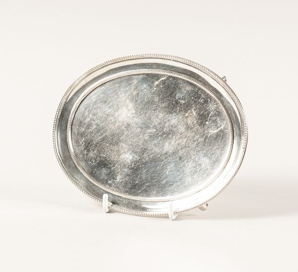 A GEORGE III SILVER OVAL TEAPOT STAND