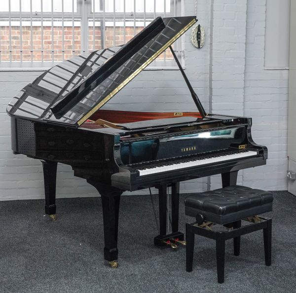 YAMAHA; A HIGH GLOSS EBONISED C3 IRON FRAMED OVERSTRUNG BABY GRAND PIANO