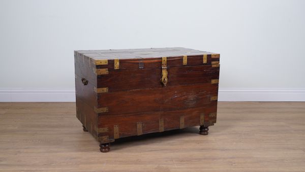 AN 19TH CENTURY ANGLO-INDIAN BRASS BOUND TEAK RECTANGULAR TRUNK