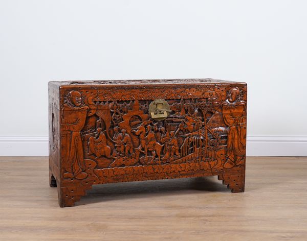 AN EARLY 20TH CENTURY EASTERN EXPORT CARVED CAMPHOR WOOD TRUNK