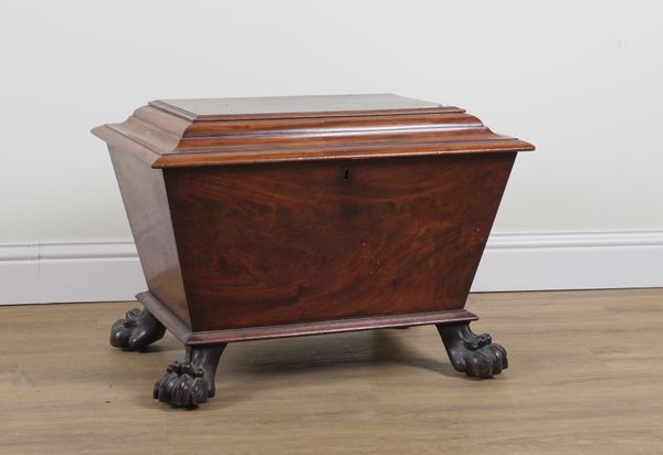 STRAHAN; AN IRISH REGENCY MAHOGANY SARCOPHAGUS SHAPED CELLARETTE