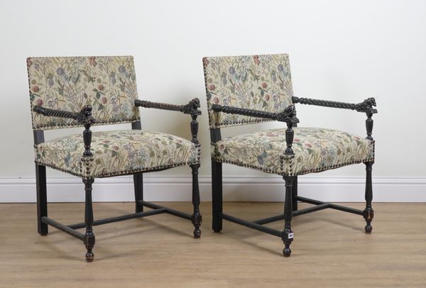 A PAIR OF 19TH CENTURY EBONISED SQUARE BACK OPEM ARMCHAIRS (2)